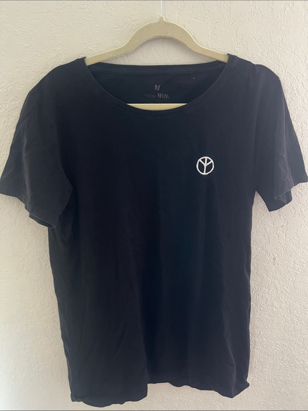Black Crewneck Short-Sleeve Tee with White Peace Emblem